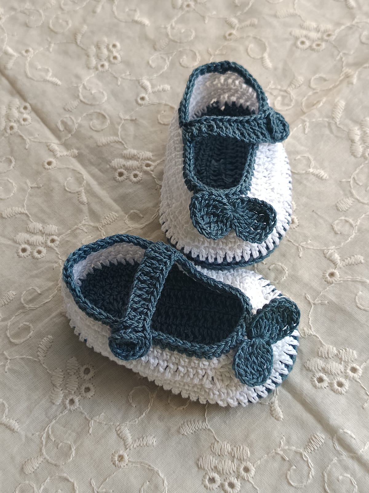 White with blue border booties