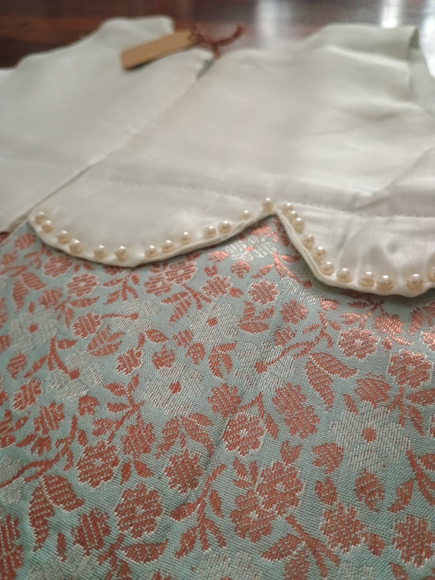 Sleeveless light blue copper brocade