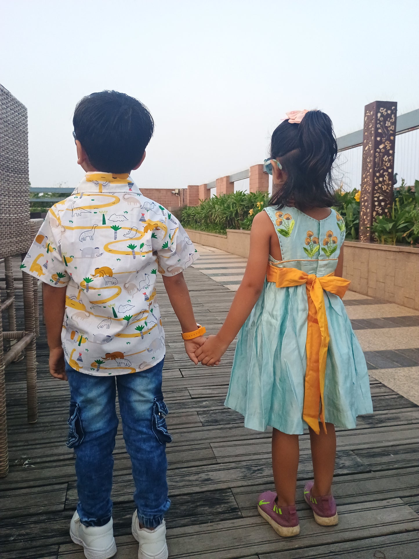 Sleeveless linen satin light blue gathered frock with embroidery