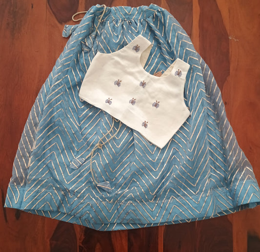 Sleeveless crop top in cream linen satin and organza sky blue skirt.
