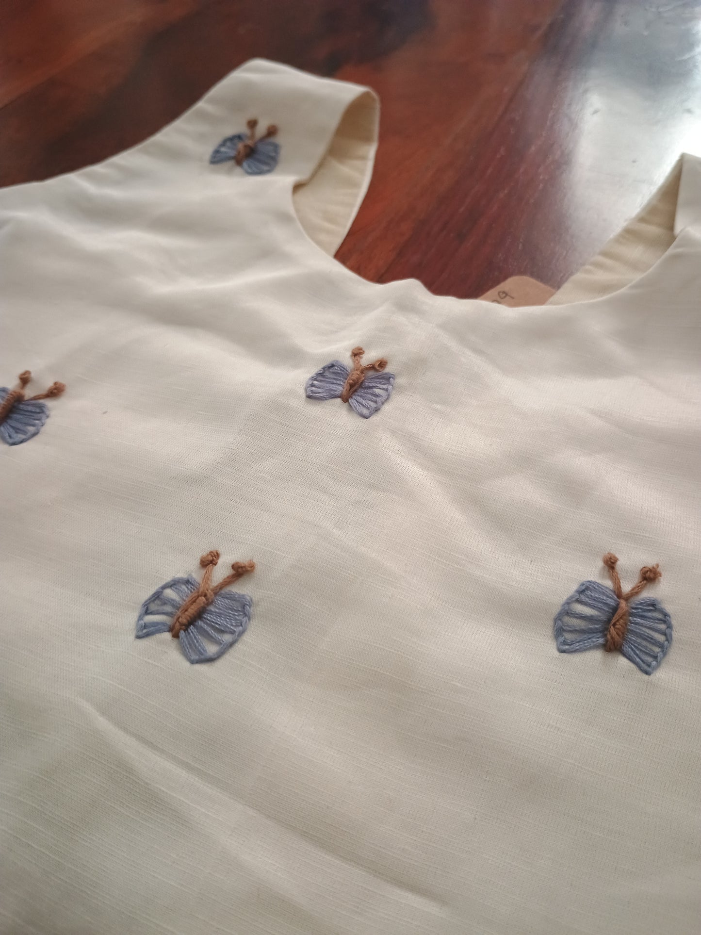 Sleeveless crop top in cream linen satin and organza sky blue skirt.