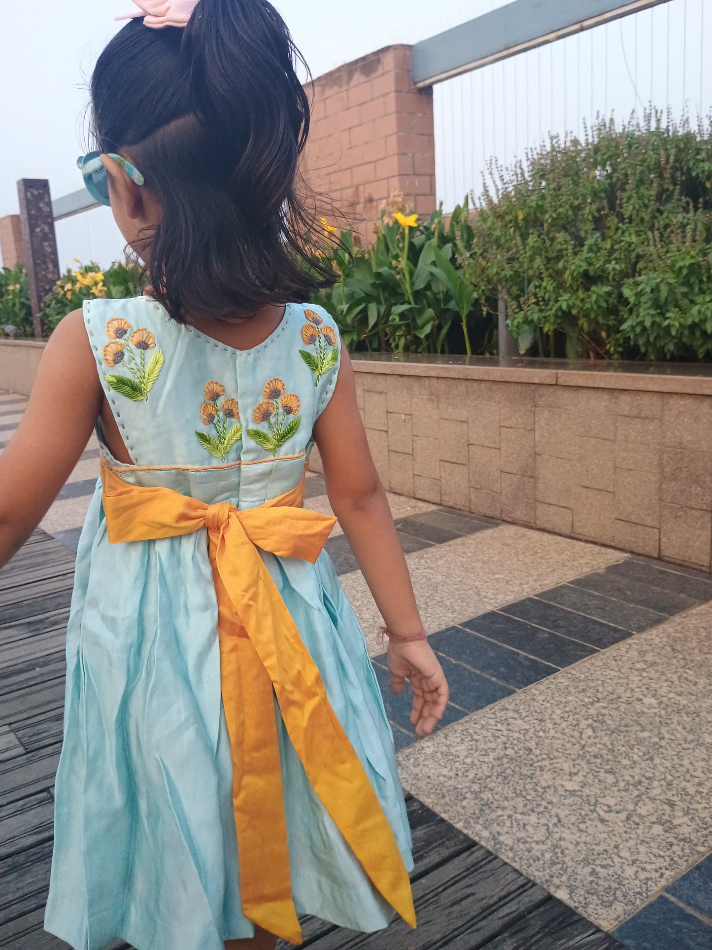 Sleeveless linen satin light blue gathered frock with embroidery